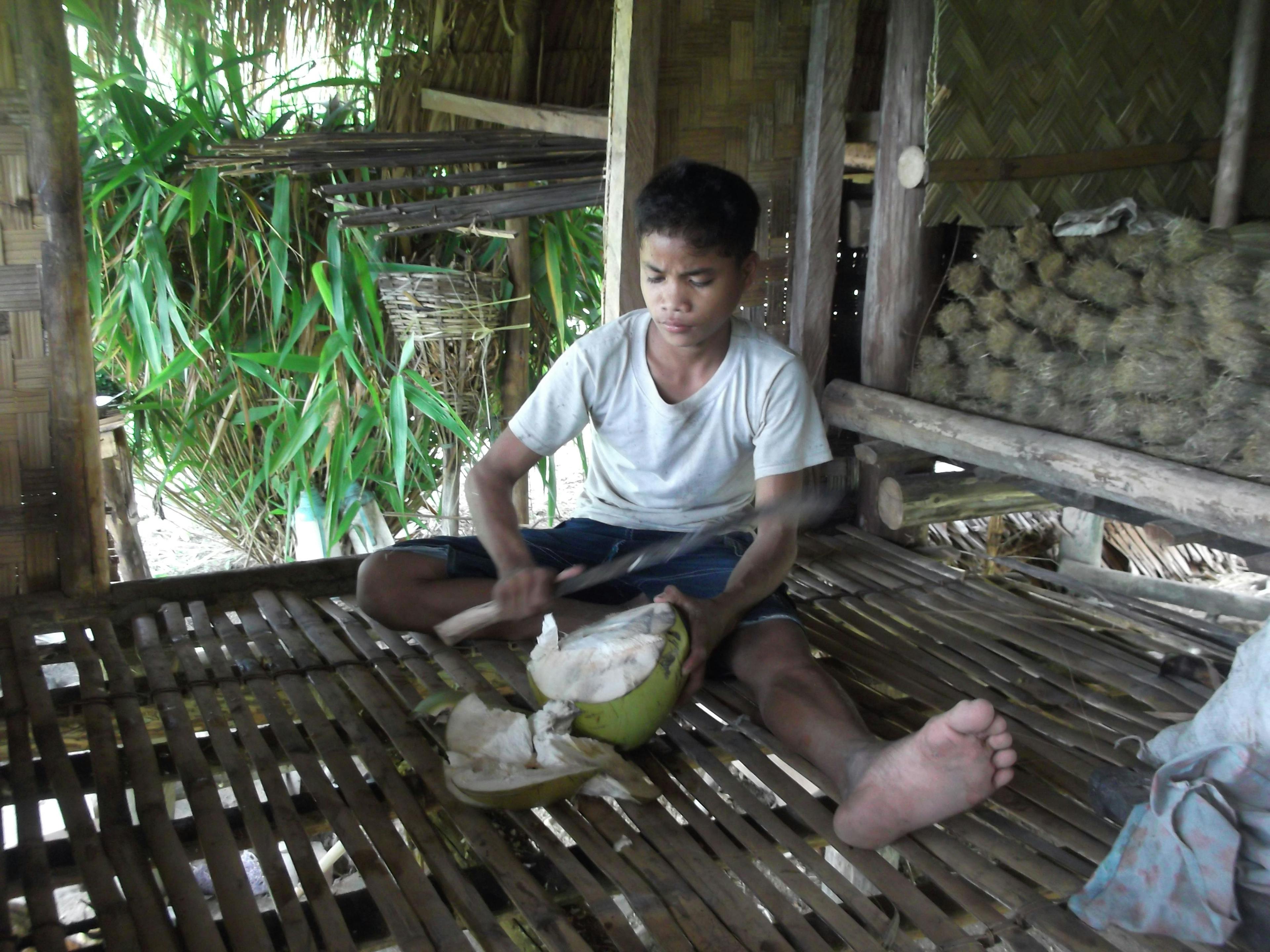 boy-cutting-coconut.JPG